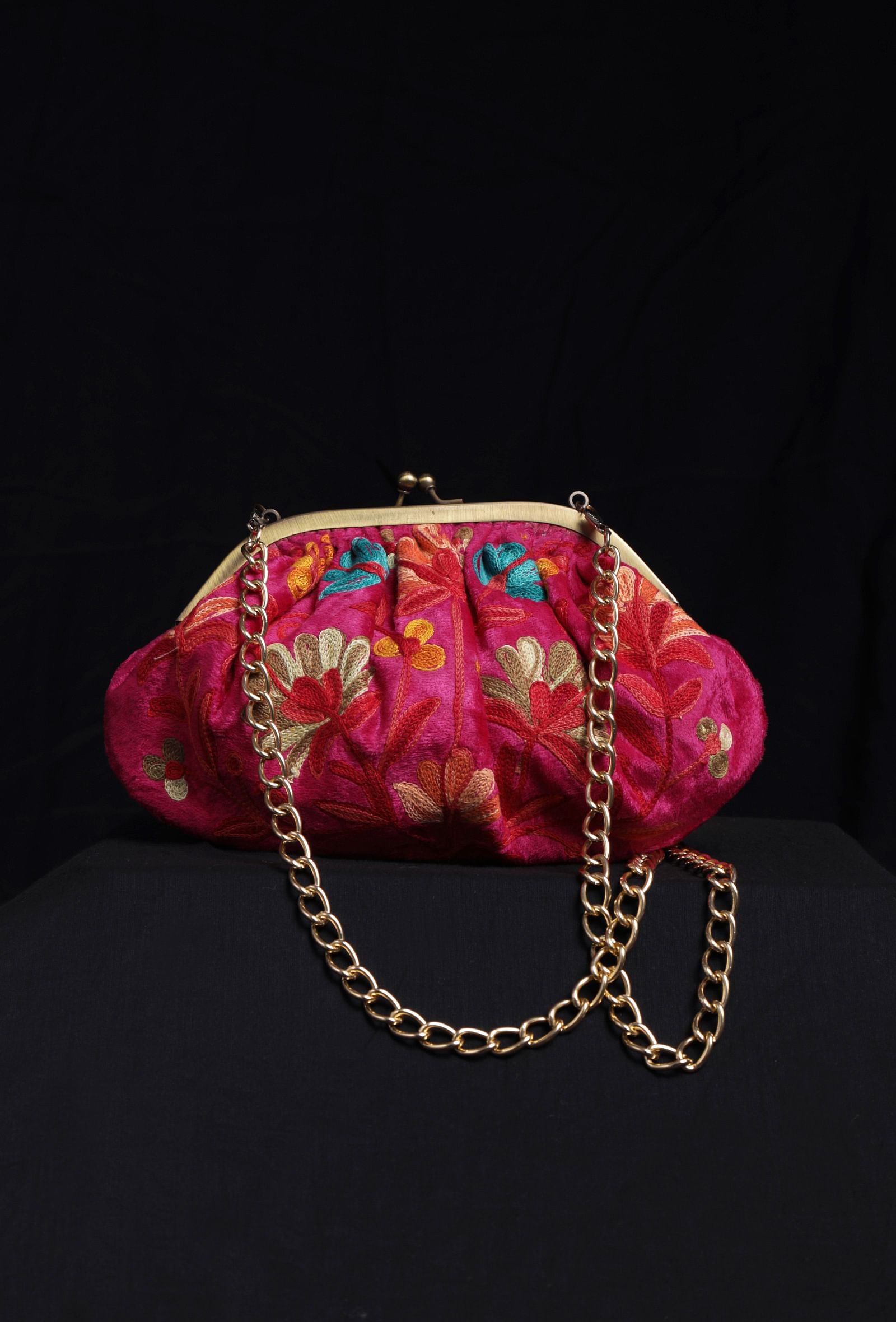 Pink gathered clutch
