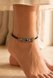 Pair of German Silver Anklets with Lion Charm, Evil Eye, and Black Beads