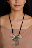 Golden and black handcrafted German silver Narmada necklace with antique finish by Saagah by Tjori