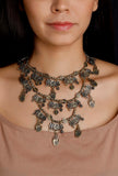 Golden and black handcrafted German silver Shraddha necklace with devotional antique detailing by Saagah by Tjori