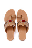 Handcrafted cruelty-free leather heels in tan and silver with pom poms
