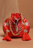 Shreenath’s Radiant Orange Potli With White Moti