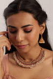 Traditional pink and green guttapusalu alloy necklace and jhumka earrings set by Saagah by Tjori