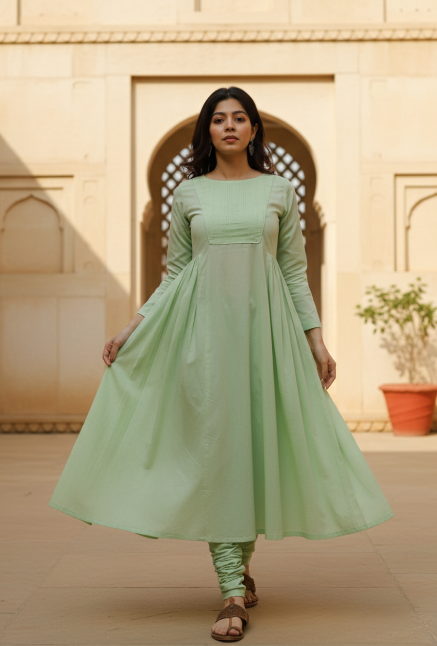 Model wearing light green cotton kurta with relaxed silhouette, easy everyday ethnic wear