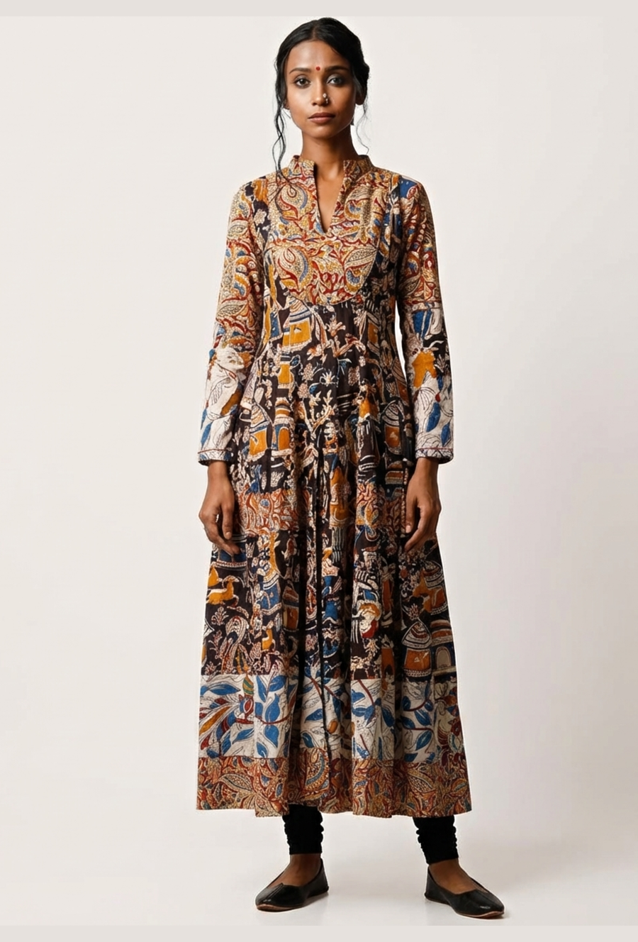 Front view of long handcrafted Kalamkari cotton anarkali kurta in black, yellow and blue traditional prints