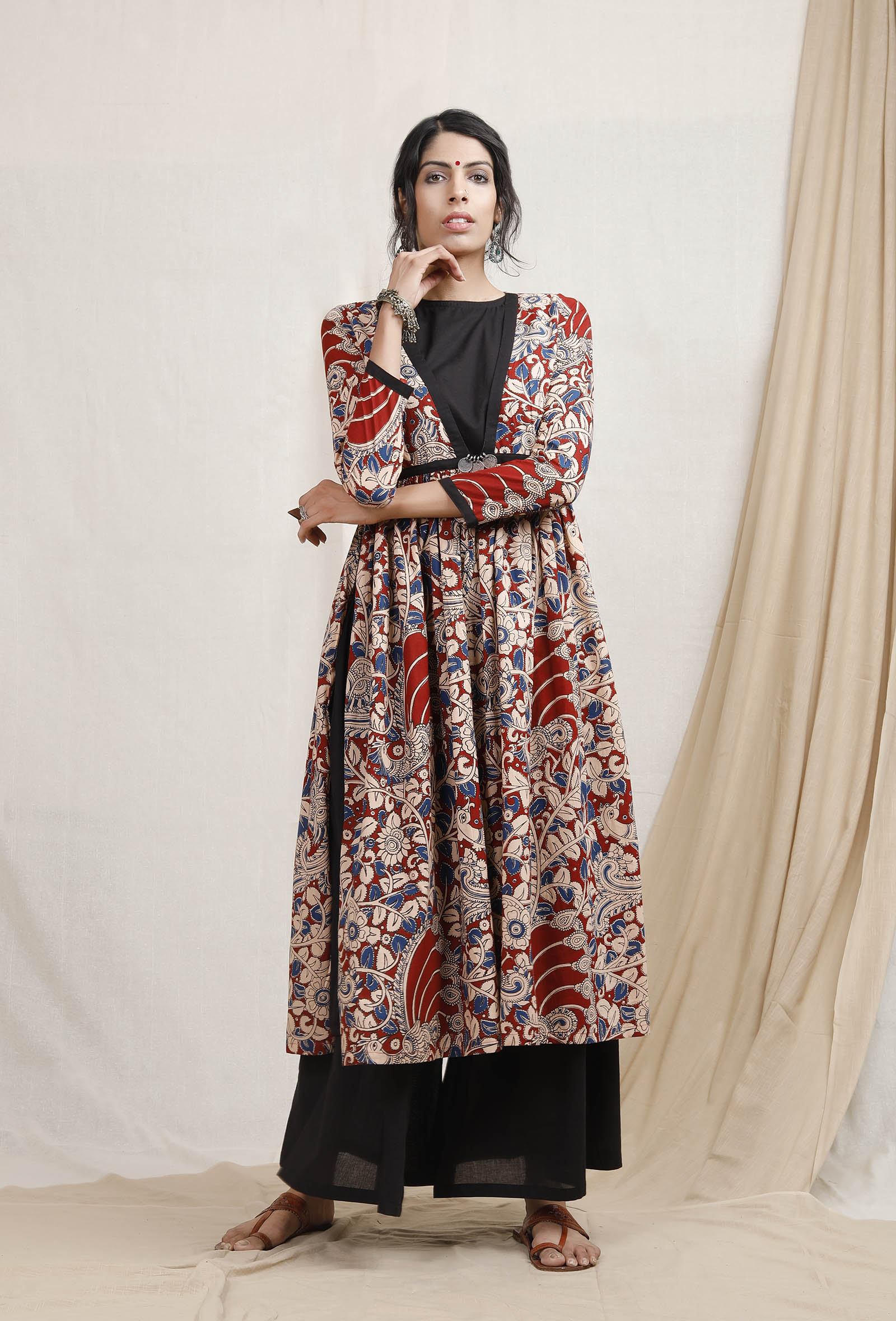 Kalamkari hand-block printed red cape overlay with vintage coins on a female model