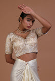 Off white raw silk embroidered festive blouse for women from Tjori