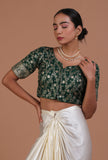 Bottle green raw silk blouse with handcrafted embroidery for festive and wedding wear by Tjori