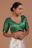 Light green raw silk embroidered blouse festive on a female model