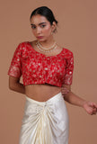 Red raw silk embroidered blouse festive on a female model