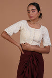 Off white cotton chikankari blouse festive on a female model