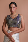 Blue raw silk mirror work blouse vibrant festive on a female model