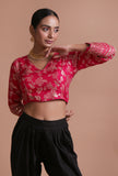 Pink raw silk embroidered blouse festive on a female model