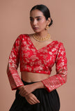 Red raw silk embroidered blouse for festive and bridal occasions by Tjori