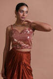 Red raw silk blouse with handcrafted sitara work embellishment for festive and bridal occasions by Tjori