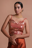 Pink raw silk blouse with handcrafted sitara work embellishment for festive and bridal occasions by Tjori