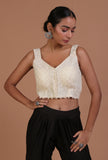 Off-white cotton blouse with handcrafted sitara work embellishment for festive and bridal occasions by Tjori