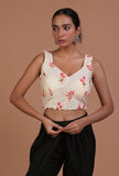 Woman wearing off-white cotton machine embroidery blouse by Tjori