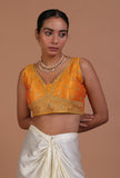 Yellow raw silk embroidered blouse for festive and wedding occasions by Tjori