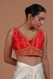 Red raw silk embroidered blouse for festive and bridal occasions by Tjori