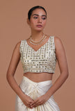 Mint green raw silk blouse with intricate mirror work embellishment for festive and bridal occasions by Tjori