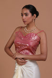 Light pink raw silk blouse with handcrafted sitara work embellishment for festive and bridal occasions by Tjori