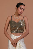 Green raw silk blouse with handcrafted sitara work embellishment for festive and bridal occasions by Tjori