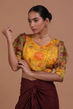 Mustard yellow organza printed blouse for festive and bridal occasions by Tjori