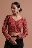 Model wearing maroon Ajrakh print cotton full sleeve blouse, handcrafted artisan ethnic blouse by Tjori