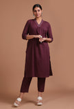 Dark brown cotton plain kurta and pant set on a female model
