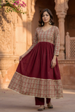 Woman wearing a red Baagh block print flared kurta with solid cotton pants by Tjori