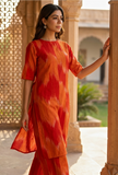 Orange ikat cotton straight kurta for women with round neck and half sleeves by Tjori