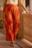 Orange Ikat wide-leg cotton pants by Tjori, bold woven pattern, ethnic casual wear