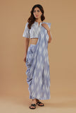 Blue ikat woven cotton saree with matching short-sleeve crop blouse and flared pant, festive ethnic wear by Tjori