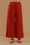Rust coloured cotton straight fit pant with minimal solid design, front view.