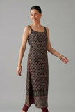 Front view of black cotton ethnic motif slip kurta with square neckline and side slit, paired with maroon leggings.