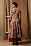 Back view of Kalidar Kalamkari cotton kurta showing flared panels and all-over red, blue and mustard print