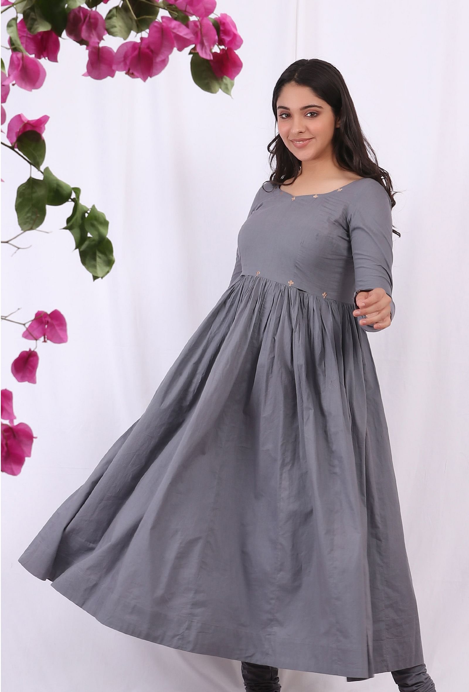 Grey embroidered cotton gathered flared kurta on a female model